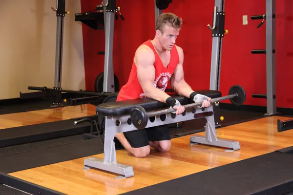 Palms-Up Barbell Wrist Curl Over A Bench